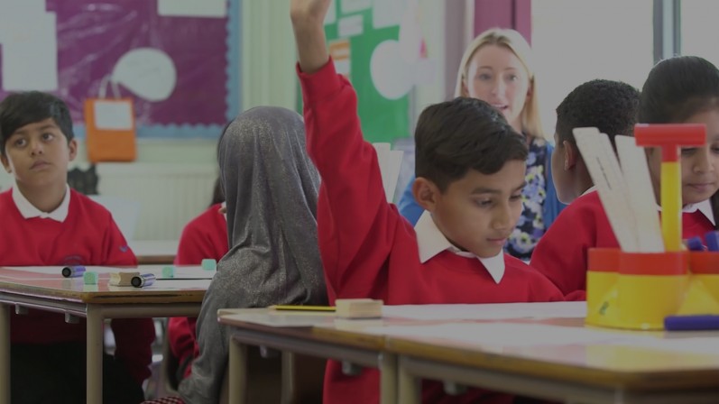 Still from training video - kids in class. 