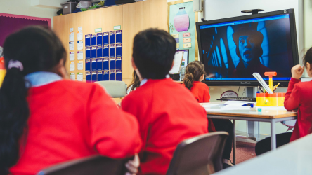 Children watching Charlie and the Chocolate Factory in class